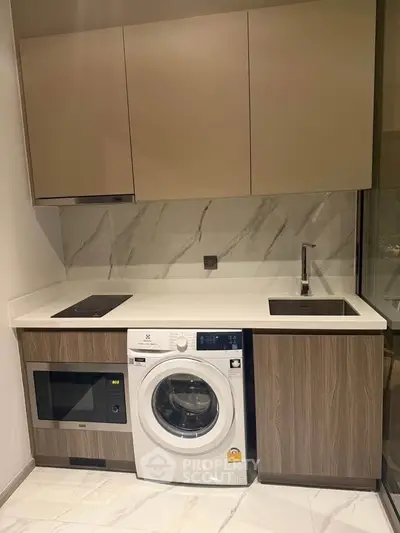 Modern kitchen with integrated appliances and sleek cabinetry
