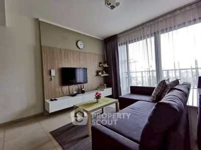 Modern living room with large windows and stylish furniture