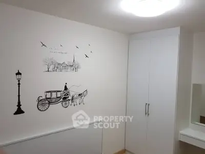 Minimalist bedroom with wall art and built-in wardrobe