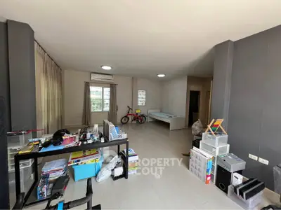 Spacious living area with modern decor and ample natural light