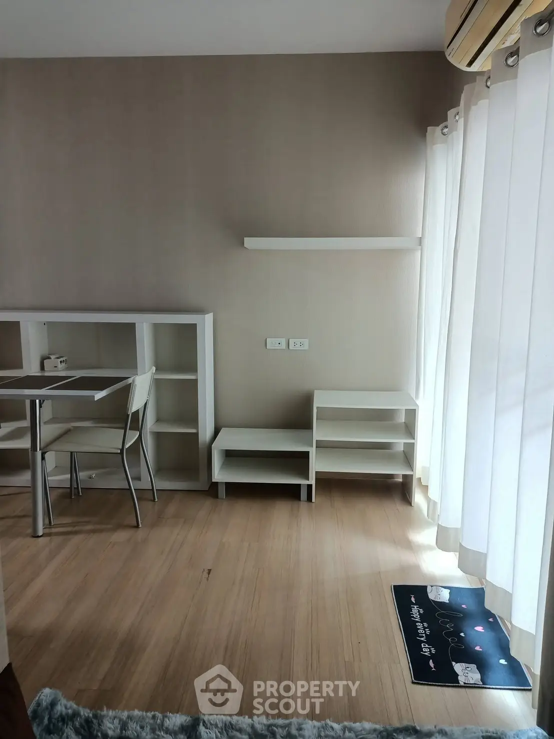 Modern minimalist living room with natural light and sleek furniture