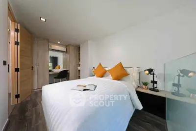 Modern bedroom with stylish decor and cozy ambiance, featuring a comfortable bed and elegant lighting.