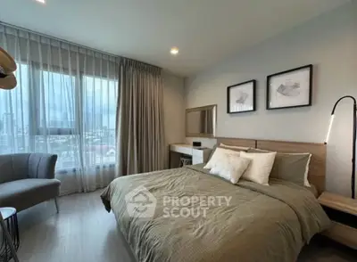 Modern bedroom with large window and stylish decor in urban apartment