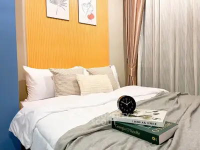 Cozy bedroom with stylish decor and comfortable bedding