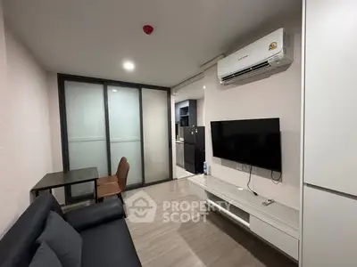 Modern living room with sleek furniture and air conditioning