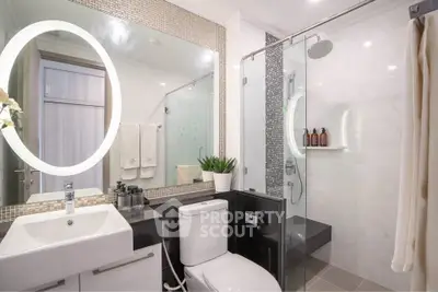 Modern bathroom with sleek fixtures and elegant shower design