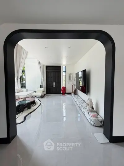 Luxurious modern living room with elegant decor and large windows