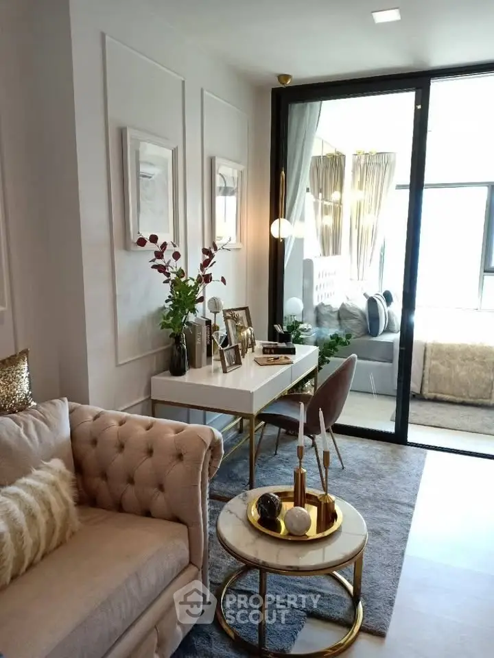 Luxurious living room with elegant decor and large windows offering natural light.