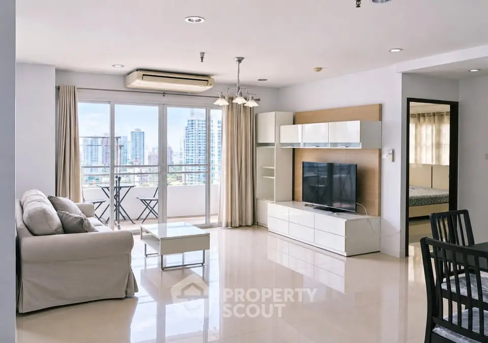 Spacious modern living room with city view and elegant furnishings