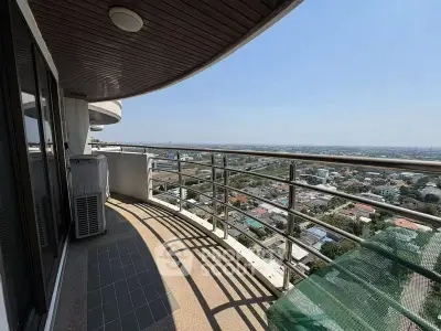 Spacious balcony with stunning panoramic city view in high-rise building