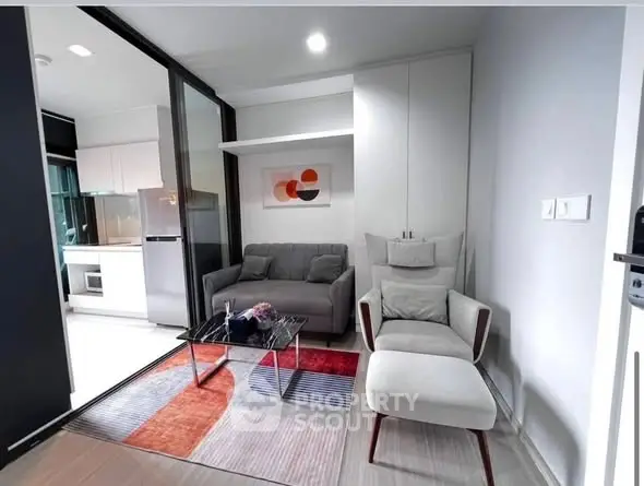 Modern living room with stylish furniture and open kitchen layout