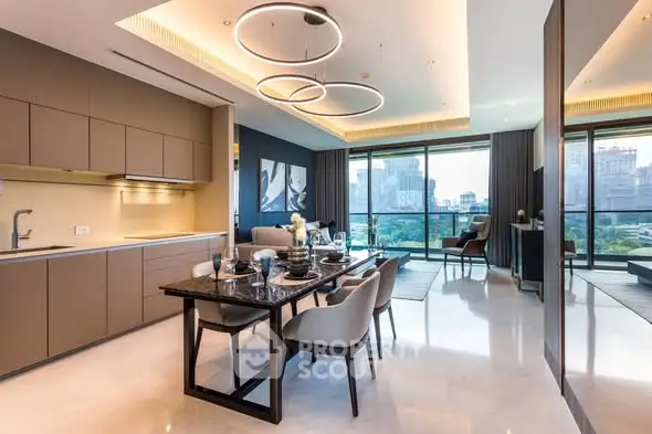 Luxurious open-plan kitchen and dining area with city view, modern lighting, and elegant decor.
