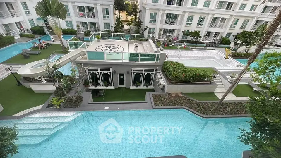 Luxurious apartment complex with stunning pool and lush greenery