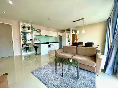 Spacious modern living room with open kitchen and stylish decor