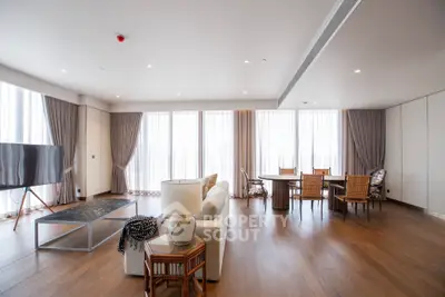 Spacious modern living room with elegant decor and large windows