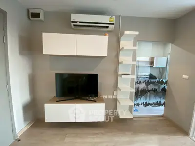 Modern living room with wall-mounted TV and air conditioning