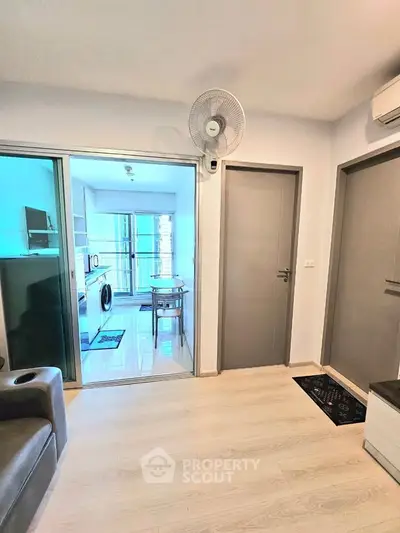 Modern apartment interior with open layout and kitchen view