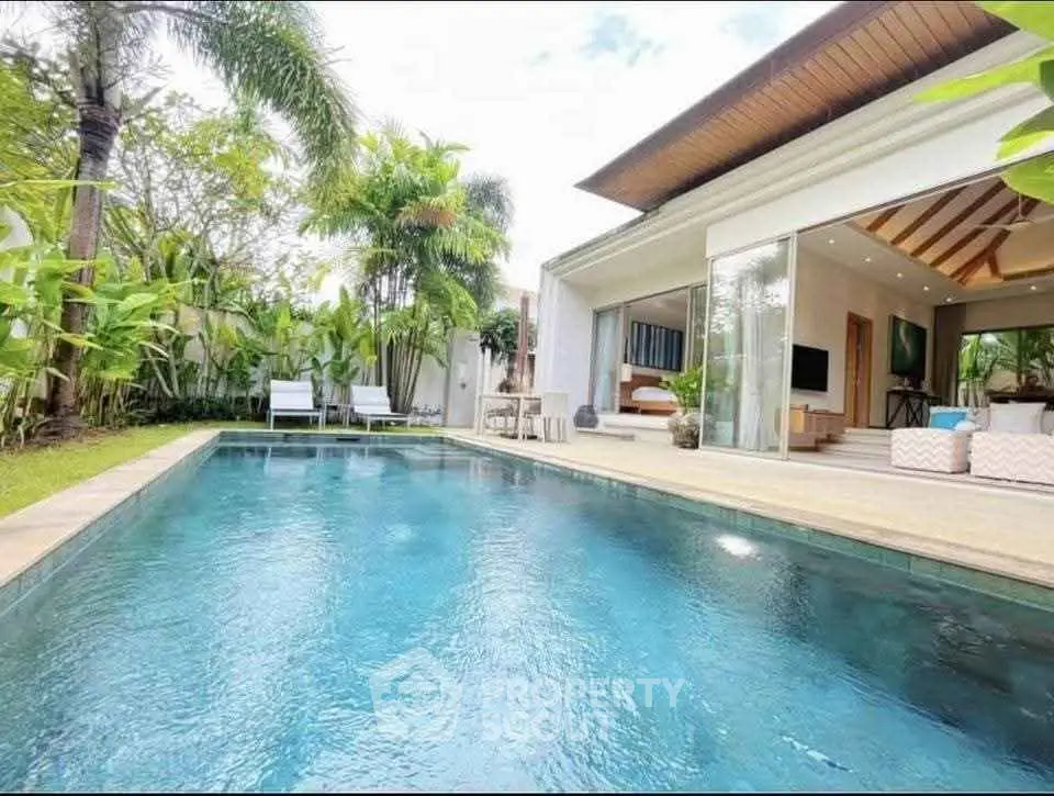 Luxurious villa with private pool and lush garden, perfect for relaxation and entertainment.