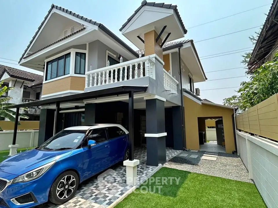 Stunning modern two-story house with carport and stylish exterior design.