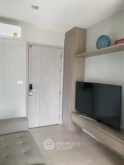Modern living room with sleek TV setup and stylish decor