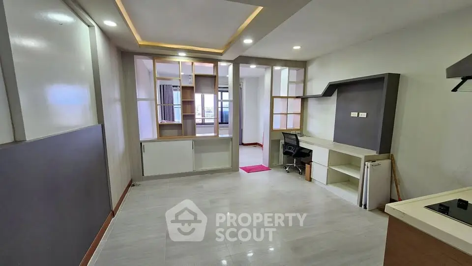 Spacious modern living area with open layout and stylish lighting