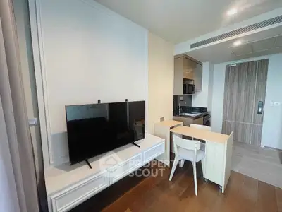 Modern apartment interior with sleek kitchen and cozy living area, perfect for urban living.