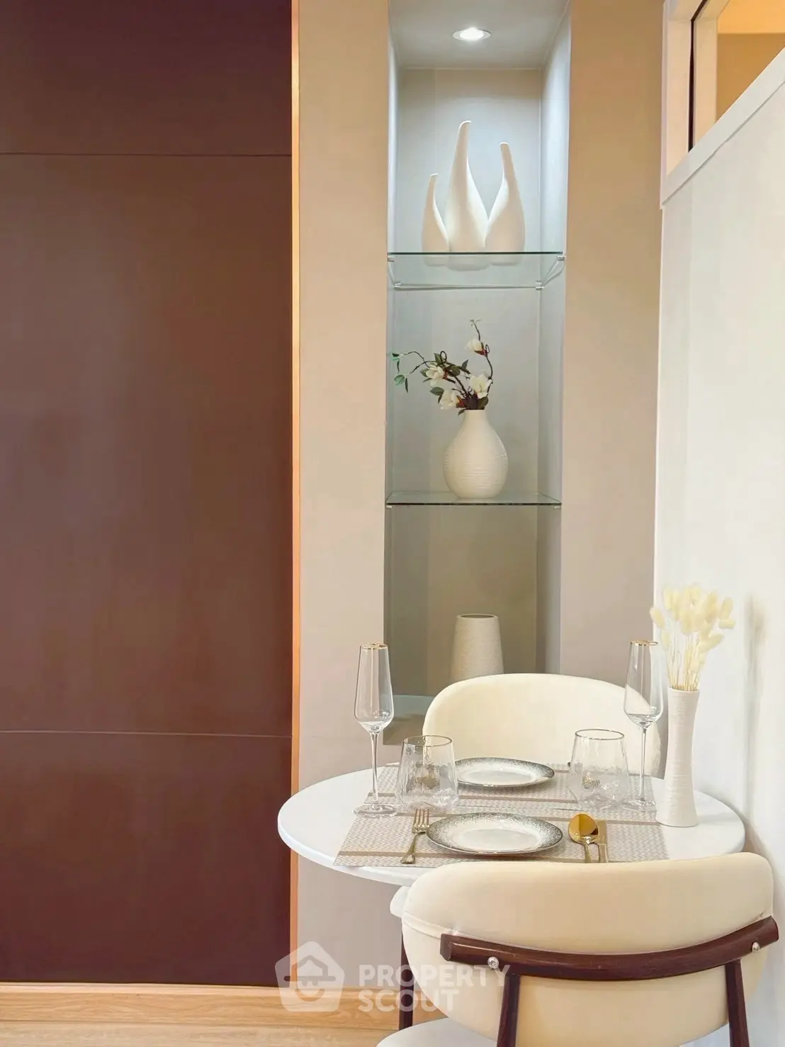 Stylish dining nook with elegant decor and modern furniture in a cozy apartment.