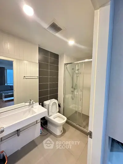 Modern bathroom with glass shower and sleek design in real estate property