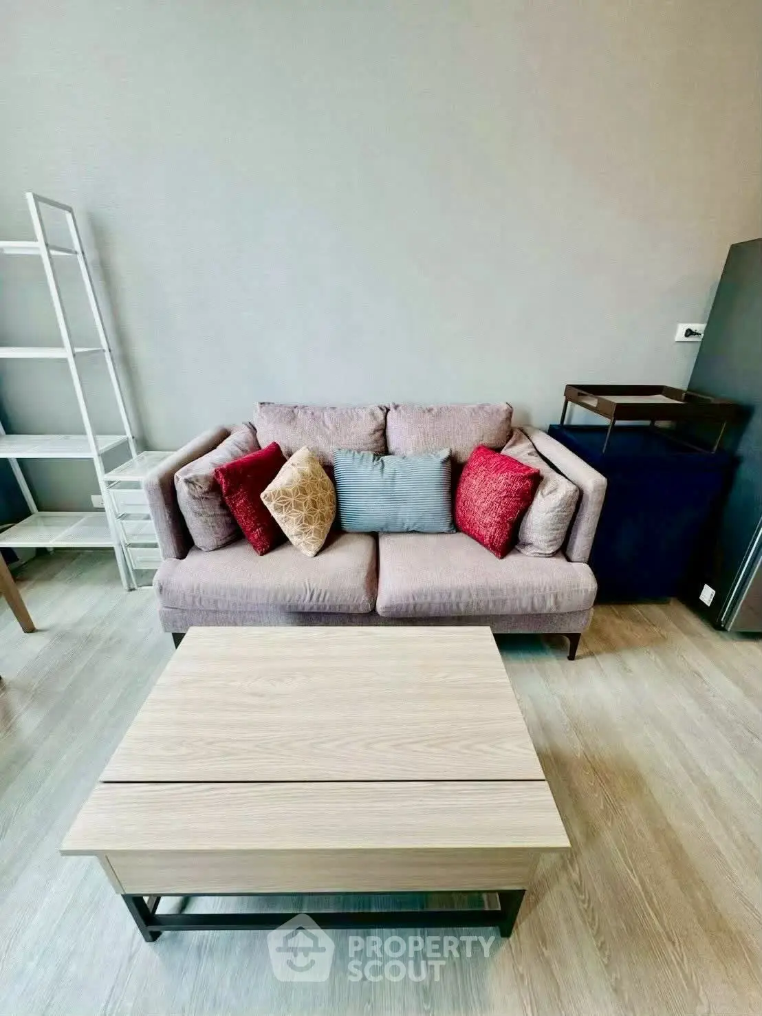 Modern living room with stylish sofa and coffee table, perfect for cozy gatherings.