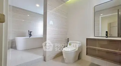 Modern bathroom with sleek design featuring a freestanding bathtub and contemporary fixtures.