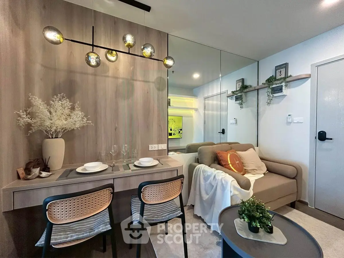Modern living room with stylish decor and cozy seating area in a contemporary apartment.