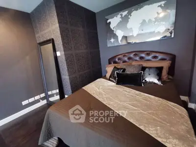 Luxurious bedroom with elegant decor and world map artwork, perfect for relaxation.