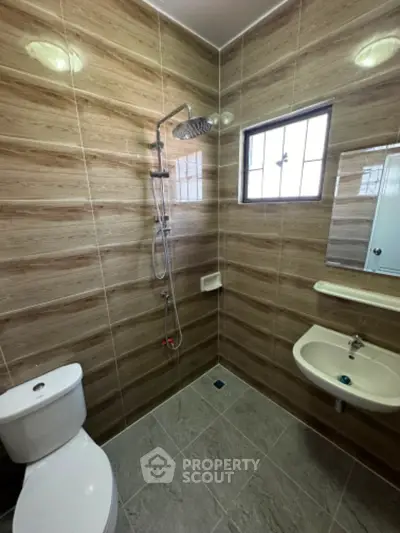 Modern bathroom with sleek tiles and contemporary fixtures