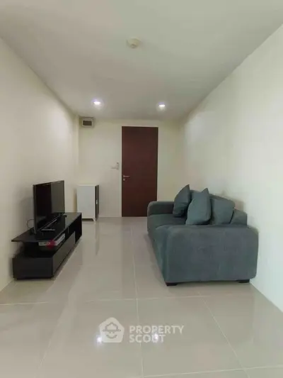 Modern living room with sleek furniture and minimalist design, perfect for urban living.