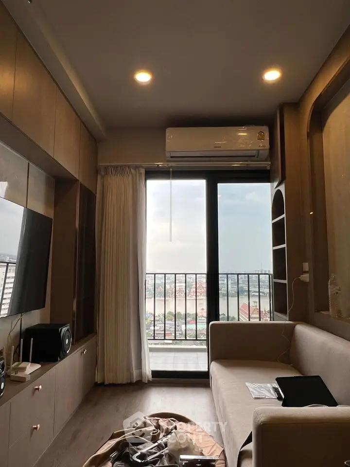 Modern living room with balcony view and sleek interior design