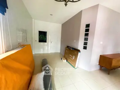 Spacious unfurnished room with tiled floor and modern lighting, ideal for customization.
