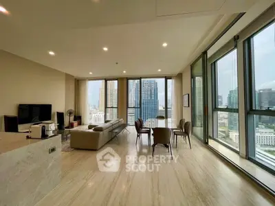 Spacious modern living room with panoramic city views and elegant furnishings.