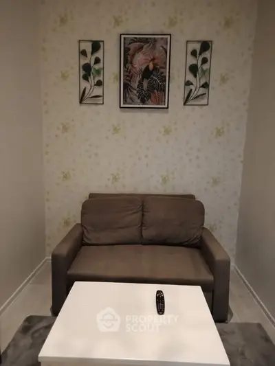 Cozy living room with stylish decor and comfortable sofa, perfect for relaxation.