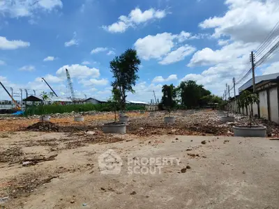 Spacious land plot with clear sky, ideal for development opportunities.