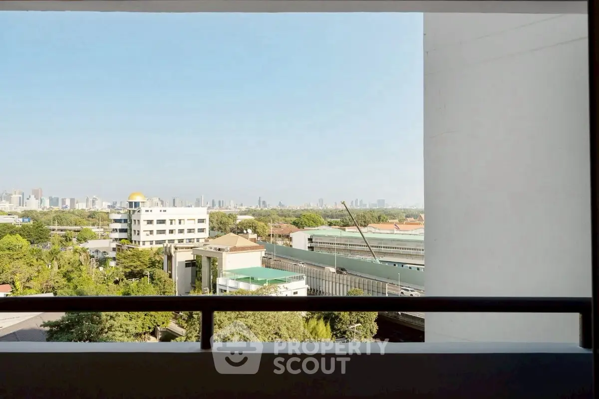 Stunning cityscape view from a high-rise balcony, perfect for urban living.