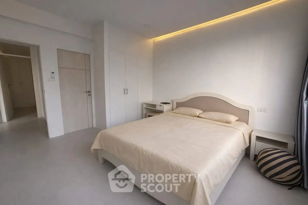 Modern bedroom with minimalist design and ambient lighting