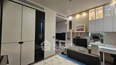 Modern studio apartment with sleek furniture and built-in appliances, perfect for urban living.
