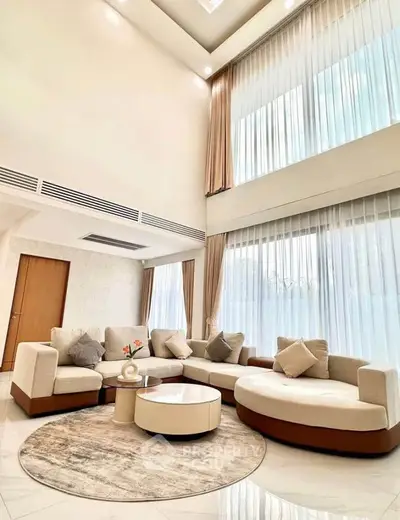 Luxurious living room with high ceilings and elegant decor in modern home