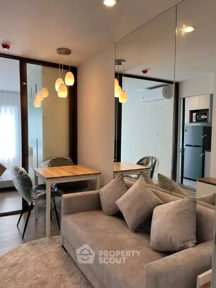 Modern living room with cozy sofa and dining area in stylish apartment