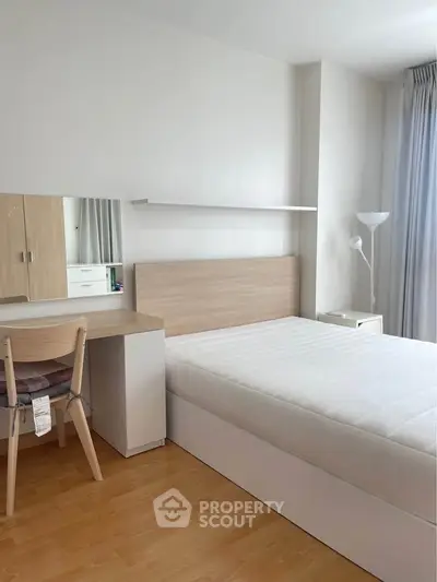 Modern minimalist bedroom with natural light and sleek furniture