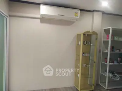 Modern interior with air conditioning and display shelves in a cozy room.