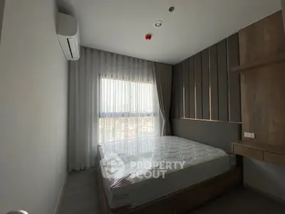 Modern minimalist bedroom with natural light and stylish decor