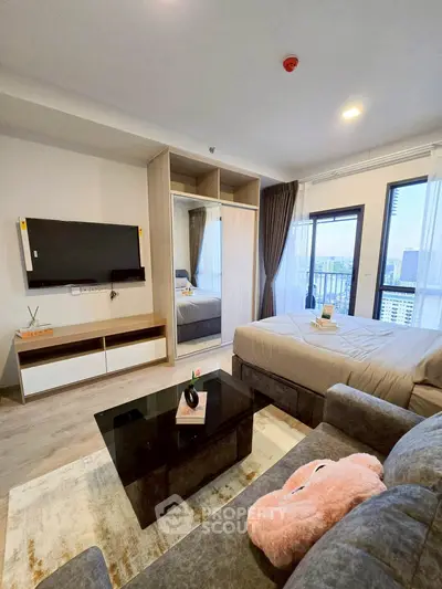 Modern studio apartment with stylish decor and city view