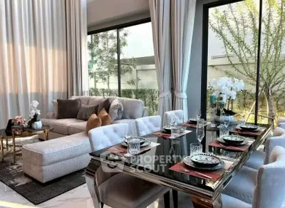 Luxurious living room with elegant dining area and large windows