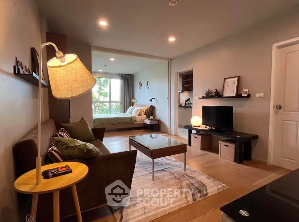 Modern open-plan living room with cozy bedroom and stylish decor